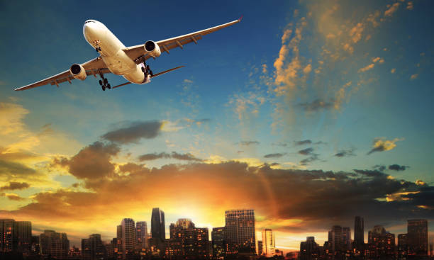 istock passenger plane departure against beautiful city building background 853744676