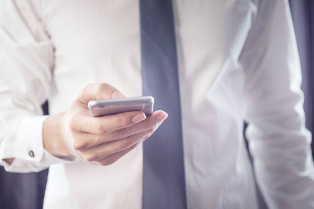 istock Close up of a business man using mobile smart phone. 853745568