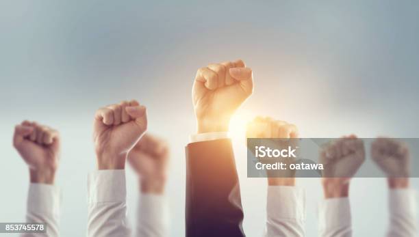 Hands Of Business Team Raised Fist Air Corporate Celebration Victory Success And Winning Concept Stock Photo - Download Image Now