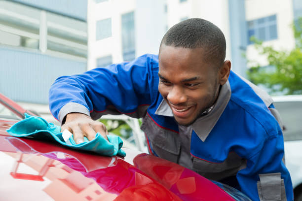 istock Male Worker Cleaning Car 853750186