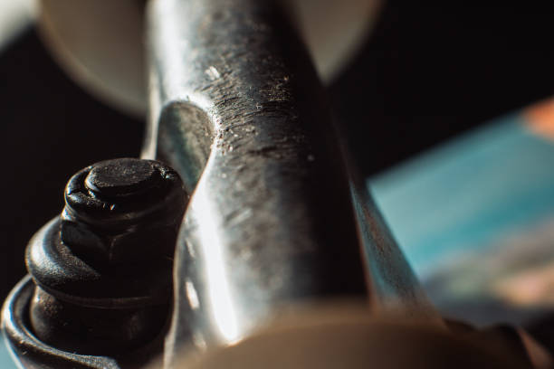Skateboard hander close up, kingpin and wheels. Professional extreme sport. Repairing and renewal of skateboarding elements, safety construction