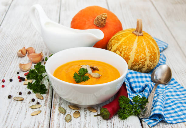istock Pumpkin soup with fresh pumpkins 853792774