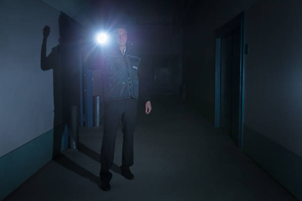 istock Security Guard Standing In Corridor Of Building 853797562
