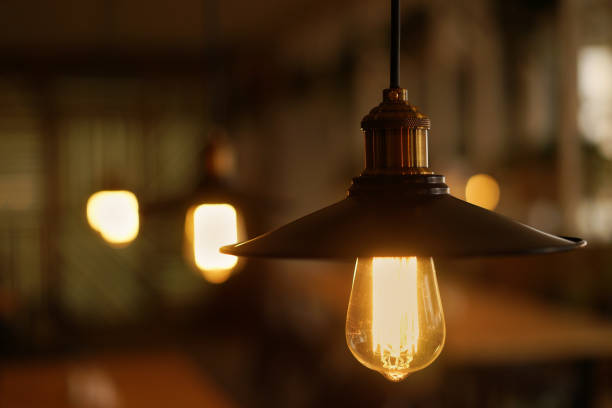 istock Incandescent lamps in a modern cafe. Edison lamp. 853798488