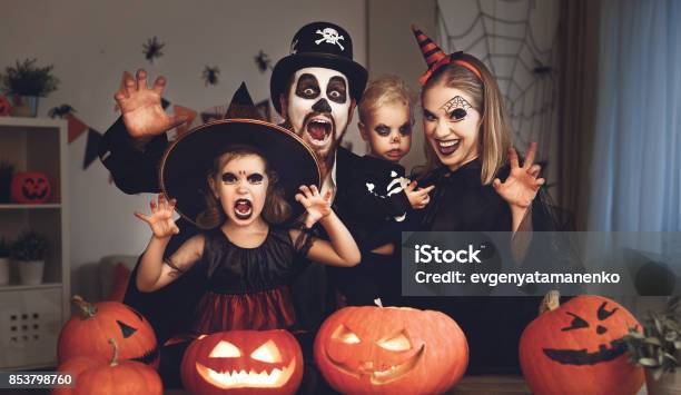 Happy Family Mother Father And Children In Costumes And Makeup On Halloween Stock Photo - Download Image Now