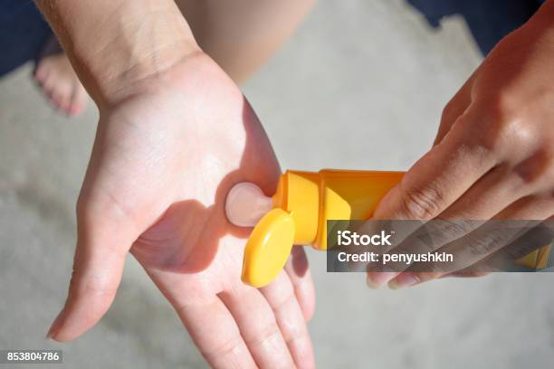 Female Hands With Sun Protection Cream Skin Care Concept Stock Photo - Download Image Now