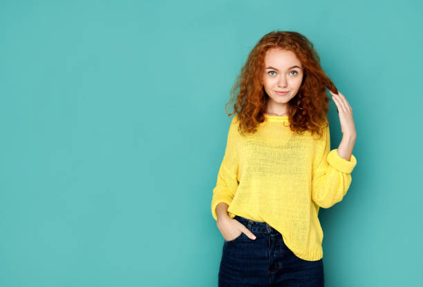 istock Cheerful girl in casual clothes posing at studio 853804896