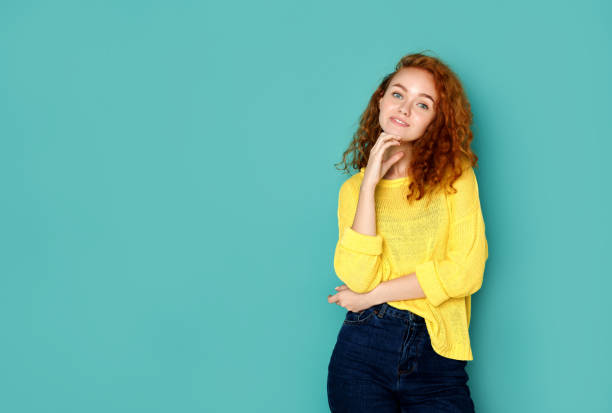 istock Cheerful girl in casual clothes posing at studio 853804954
