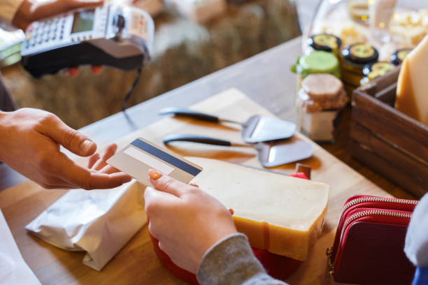 istock Customer paying for order of cheese in grocery shop. 853808974