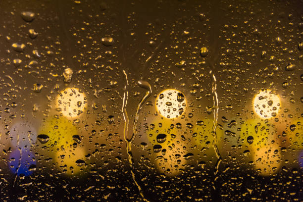 istock Flight Window with Rain and Airport Lights 853809070