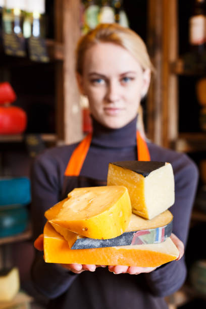 istock Various italian hard cheese in shop assistant hands 853809502