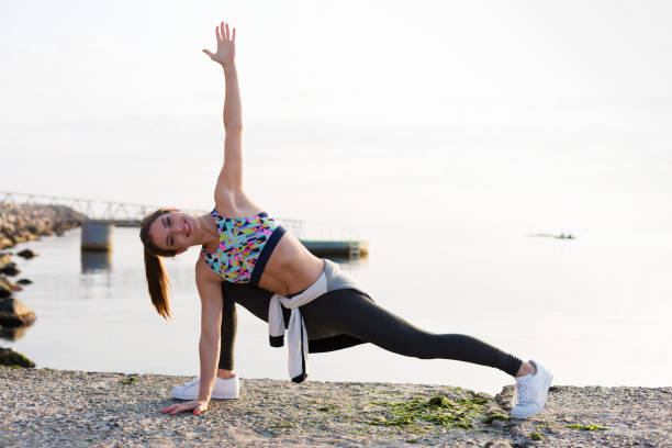 istock Woman working out on the beach 853810242