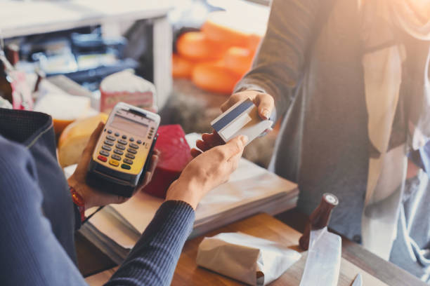 istock Customer paying for order of cheese in grocery shop. 853812404