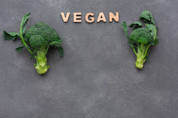 istock Vegan. Fresh green broccoli on gray background, copy space 853812524