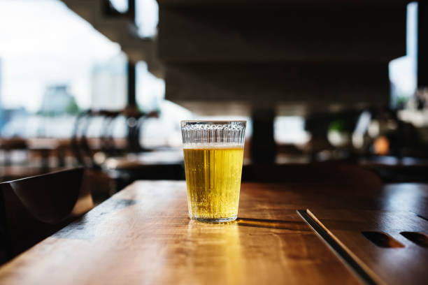 istock Beer glass on wooden bar 853814316