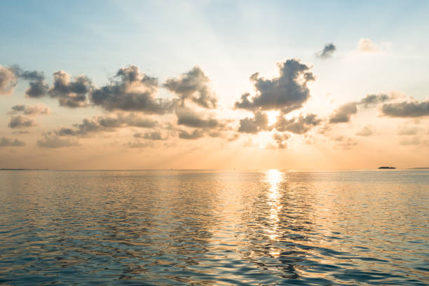 istock A gentle watercolor sunset over the ocean. 853818378