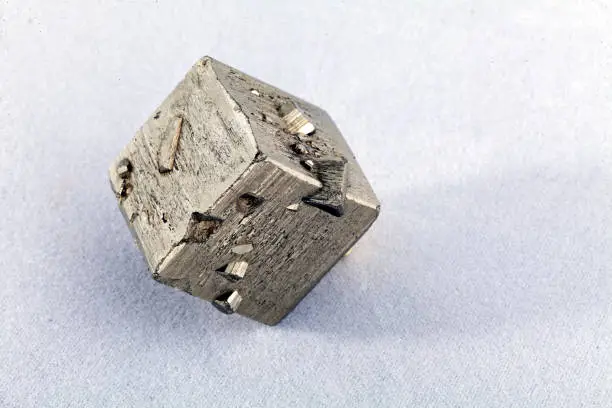 pyrites, mineral from the group of sulfides on the white background