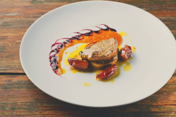 istock Roasted goose liver with date fruit and apple 853824746