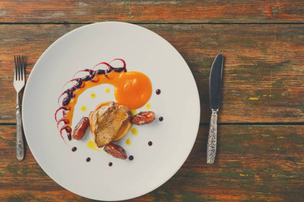 istock Roasted goose liver with date fruit and apple 853824824