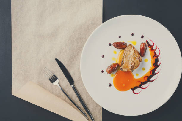 istock Roasted goose liver with date fruit and apple 853825020
