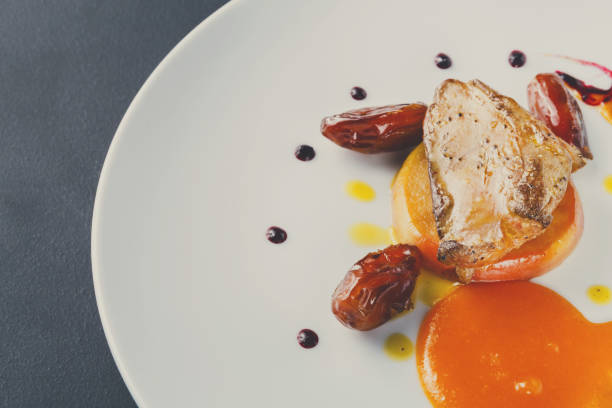 istock Roasted goose liver with date fruit and apple 853825088
