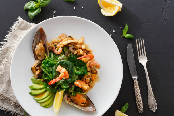 istock Warm salad with grilled seafood flat lay 853832404