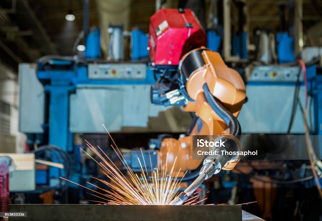 Robot welding assembly car part in factory Arm Stock Photo