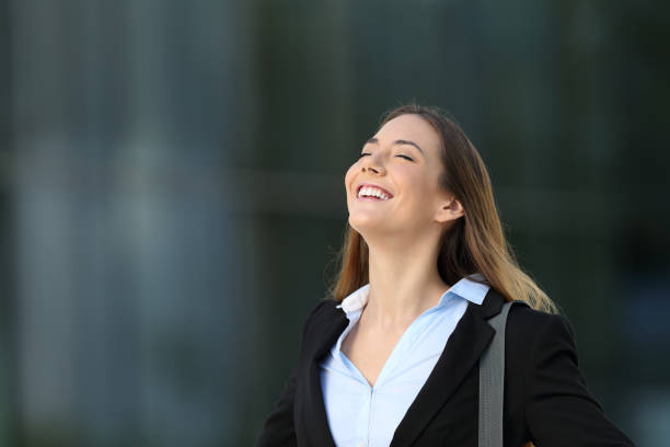 istock Happy successful executive breathing on the street 853843506