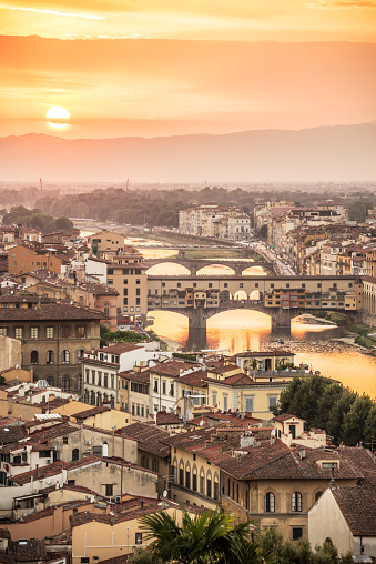 Aerial view of Florence at sunset  with the Ponte Vecchio and the Arno river, Tuscany, Italy