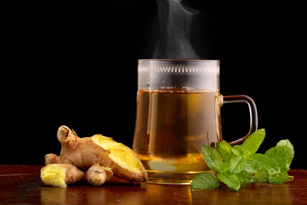 Glass of tea with ginger and mint Glass of tea with ginger and mint mint tea stock pictures, royalty-free photos & images