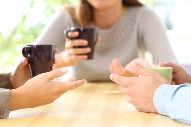istock Three friends talking and holding coffee cups 853850234