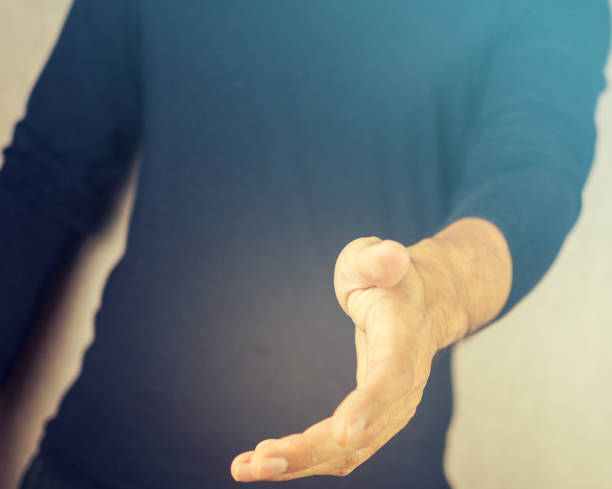istock Vintage filtered on man open hand toward, greeting and reaching 853858152