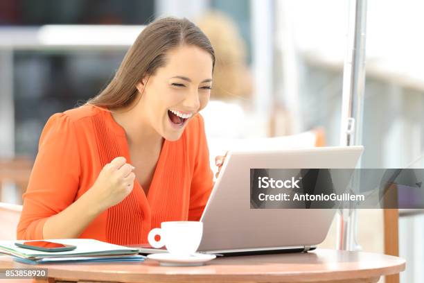 Excited Entrepreneur Receiving Good News On Line Stock Photo - Download Image Now - Finding, Occupation, Happiness