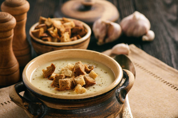 Homemade garlic cream soup with croutons. stock photo