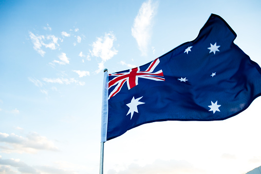 Waving Australia flag in the air.
