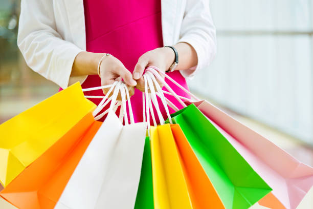 istock Woman holding shopping bags 853859954