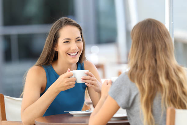 istock Two happy friends having a casual conversation 853862756