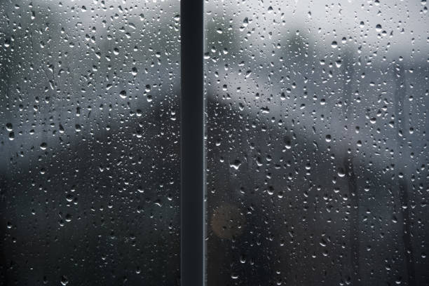 istock Abstract of Raindrops on Window 853863392