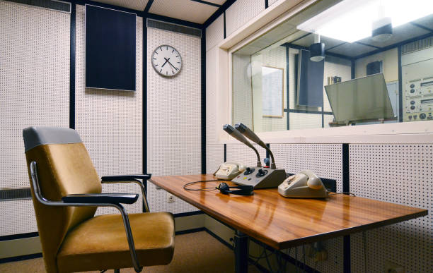istock retro style radio studio with microphones on table 853863974