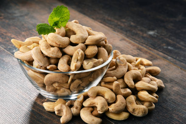 istock Bowl with cashew nuts on wooden table 853871748