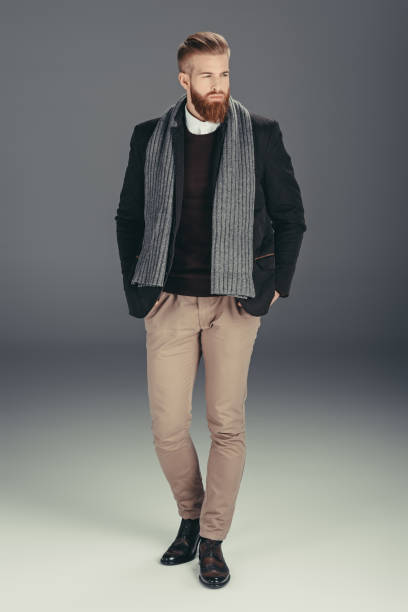 istock stylish man in jacket with scarf 853872632