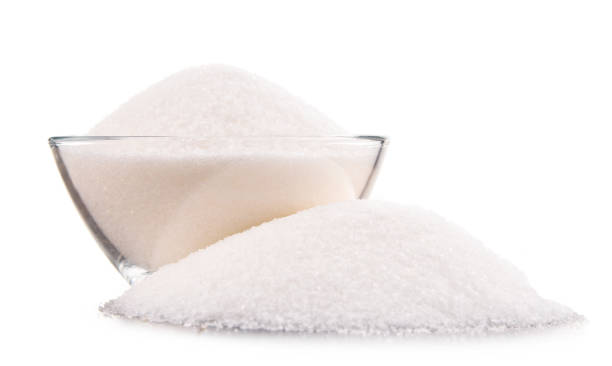 istock Bowl of white refined sugar on white background 853882236