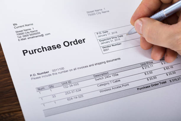 Person Filling A Purchase Order Form