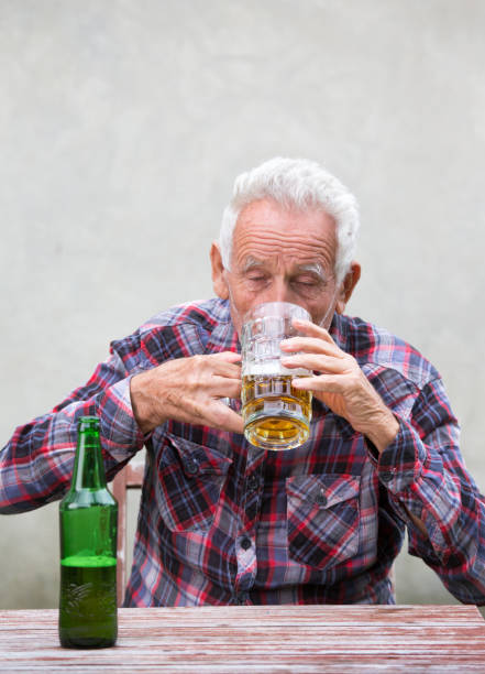 istock Senior man with beer bottle and mug 853892552