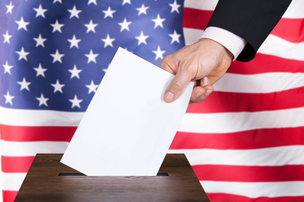 istock Businessperson Inserting Ballot In Box 853899576