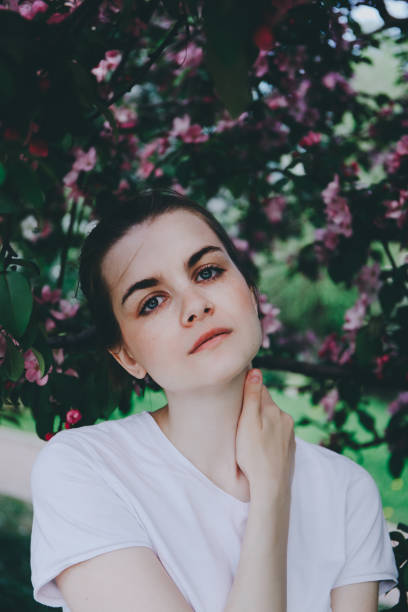 istock Girl near blossoming tree. 853904064
