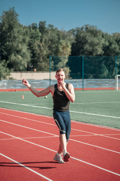 istock Man sportsman jumping with candy 853906896