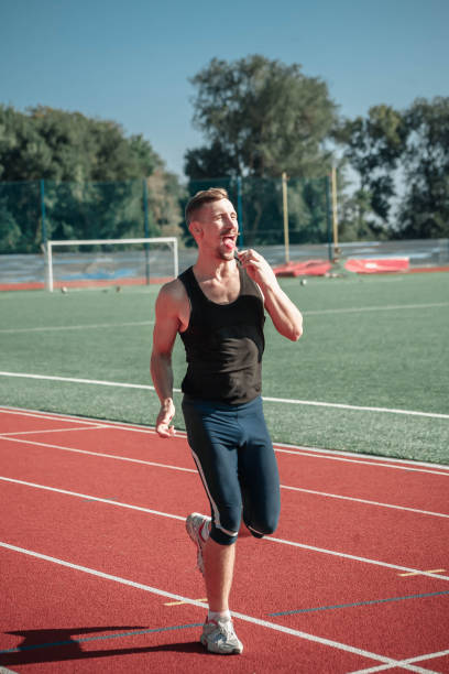 istock A merry mustachioed athlete licks a lollipop 853907050