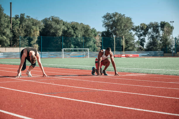 istock A pair of athletes in a spacious stadium 853907624
