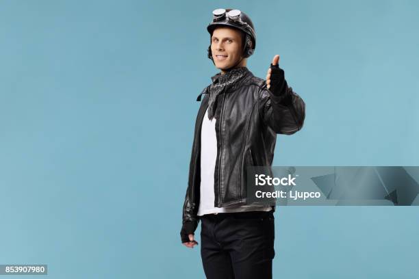 Biker Making A Thumb Up Gesture Stock Photo - Download Image Now - Biker, Portrait, 20-29 Years
